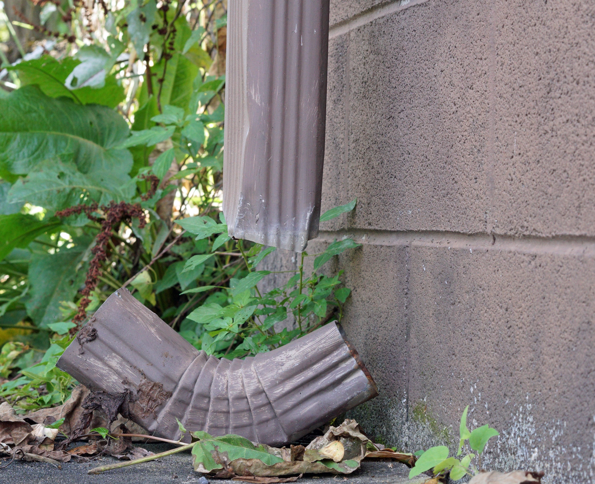 Broken gutter downspout